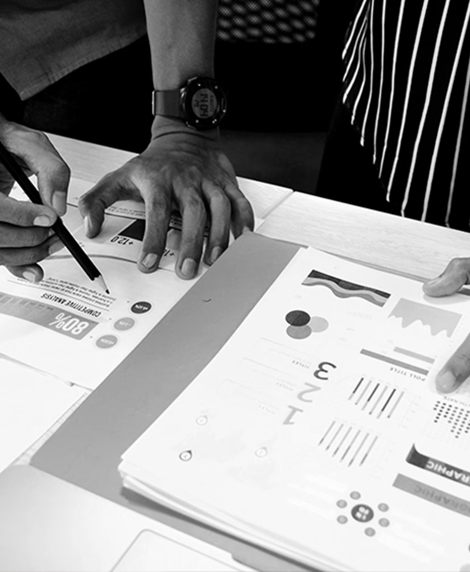 A person drawing on a piece of paper - UX Design
